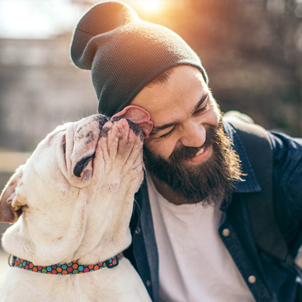 Resident getting some affection from his pooch at The Mallory in Raleigh, North Carolina