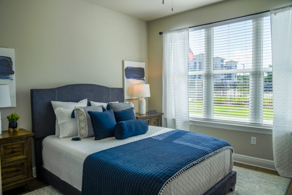 Model bedroom with lamps at The Waters at Ransley in Pensacola, Florida