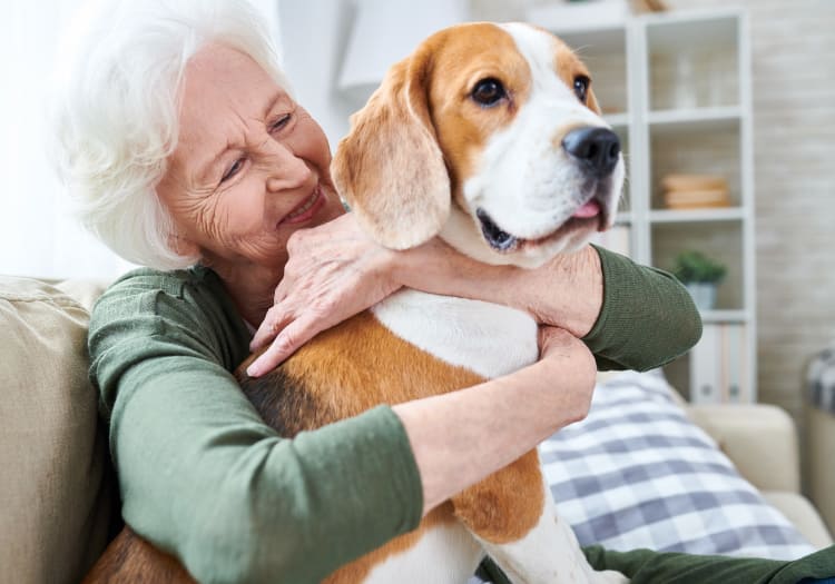 A resident and her pet dog at The Wellington
