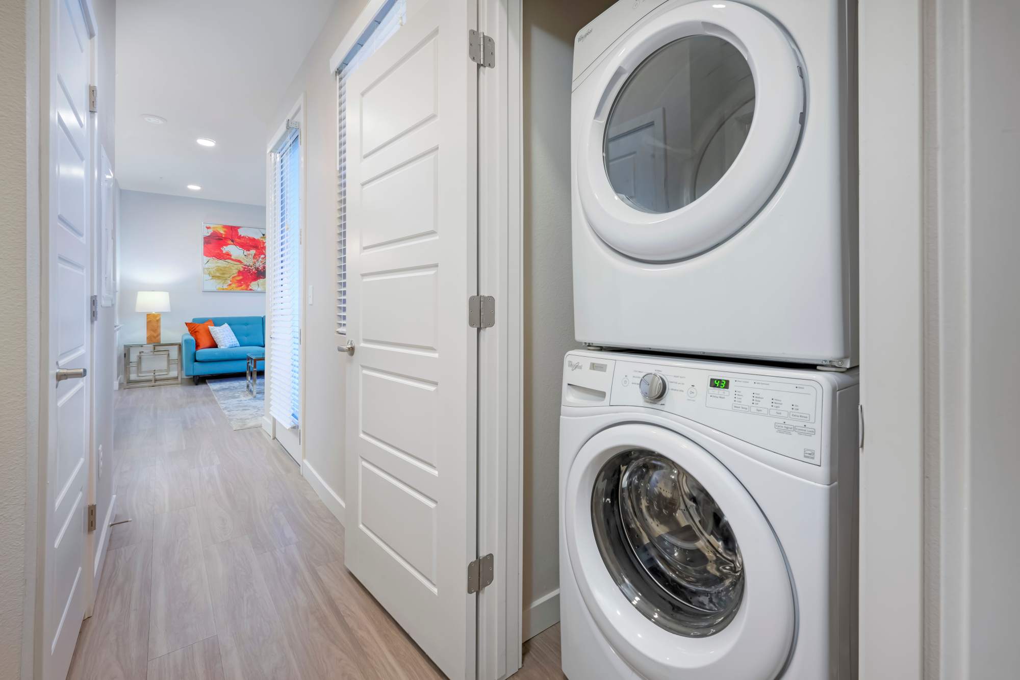 Living room and kitchen with island at Strata Apartments in Denver, Colorado