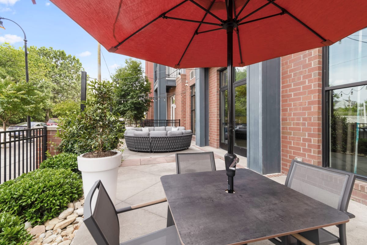 Patio space with umbrella at Lantower BullHouse in Durham, North Carolina
