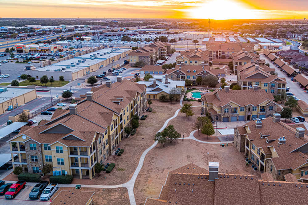 Aerial view of apartments with beautiful sunset at Blue Ridge in Midland, Texas