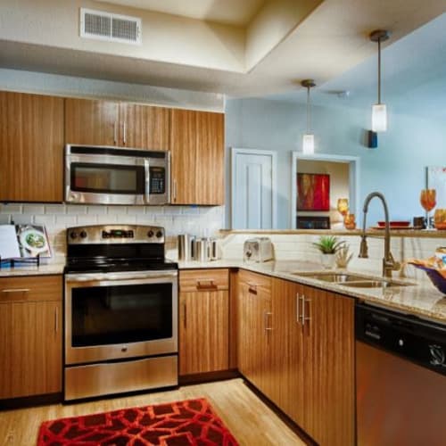 Stainless-steel appliances in a model home's kitchen at Elevation Chandler in Chandler, Arizona