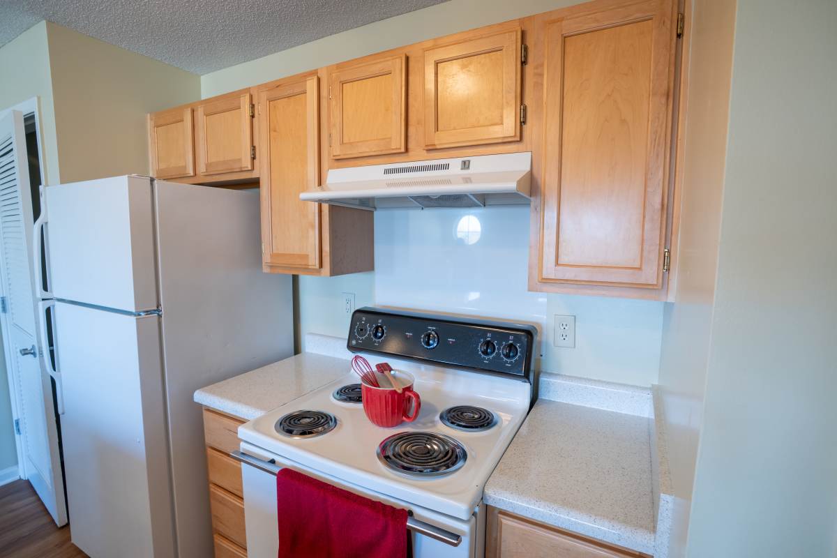 Modern kitchen with white appliances at Eagles Landing in Memphis, Tennessee