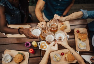 Resident friends at their favorite restaurant raising a toast to the good life at Azalea Springs in Marietta, Georgia