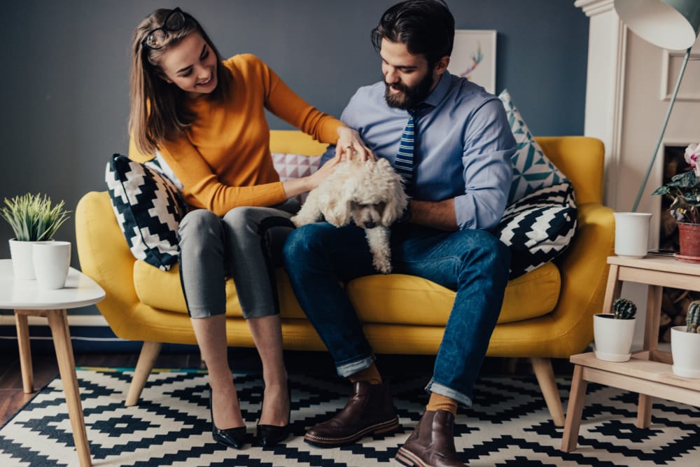 Young couple with dog at North Square Apartments at The Mill District