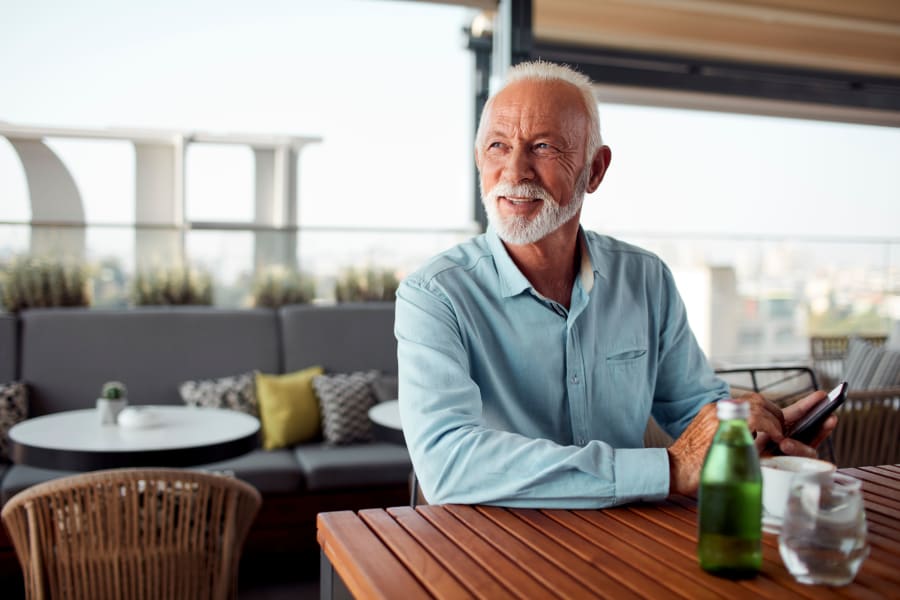 Resident enjoying drinks at Cantabria at Turtle Creek's sky lounge in Dallas, Texas
