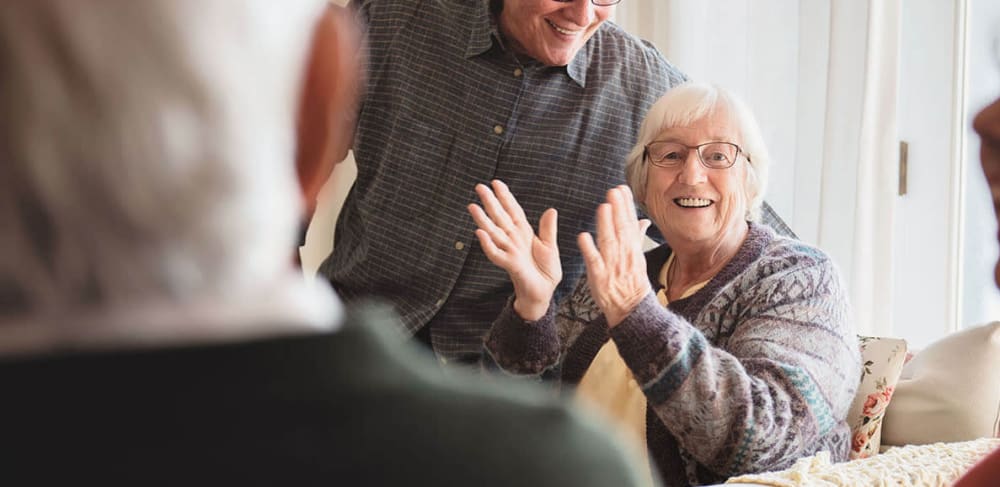 Resident of Anthology Senior Living gives an applause in Chicago, Illinois