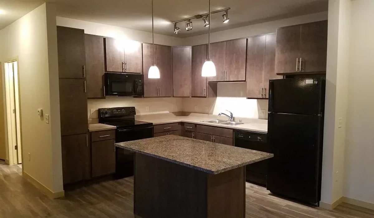 Gourmet kitchen with energy-efficient appliances at Mill Creek Apartments in Cross Plains, Wisconsin
