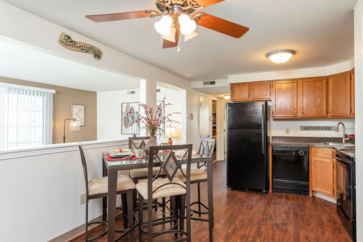 Dining table and kitchen at Maplewood Estates Apartments in Hamburg, New York