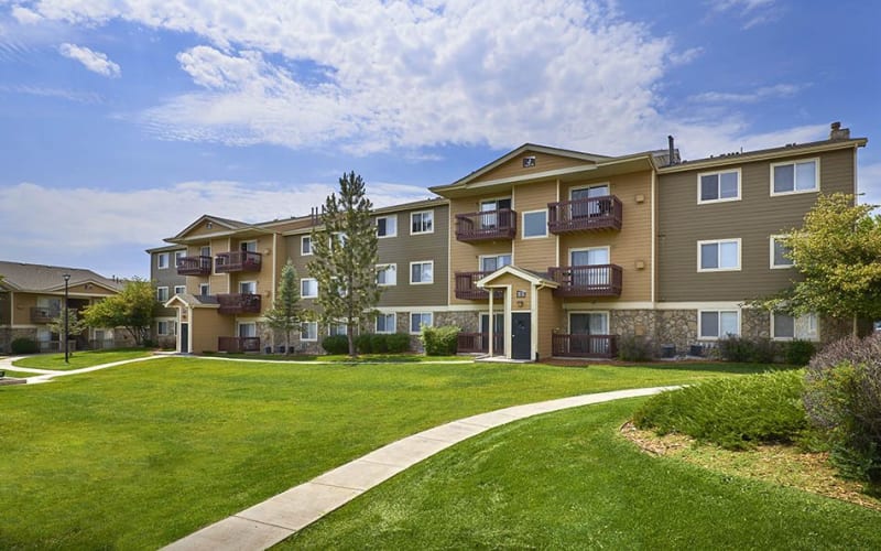 Brown and tan exterior of Crossroads at City Center Apartments in Aurora, Colorado