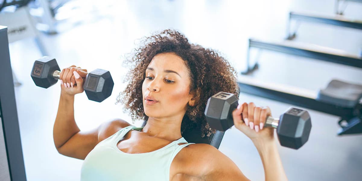 Lady lifting weights at The Copeland in Austin, Texas