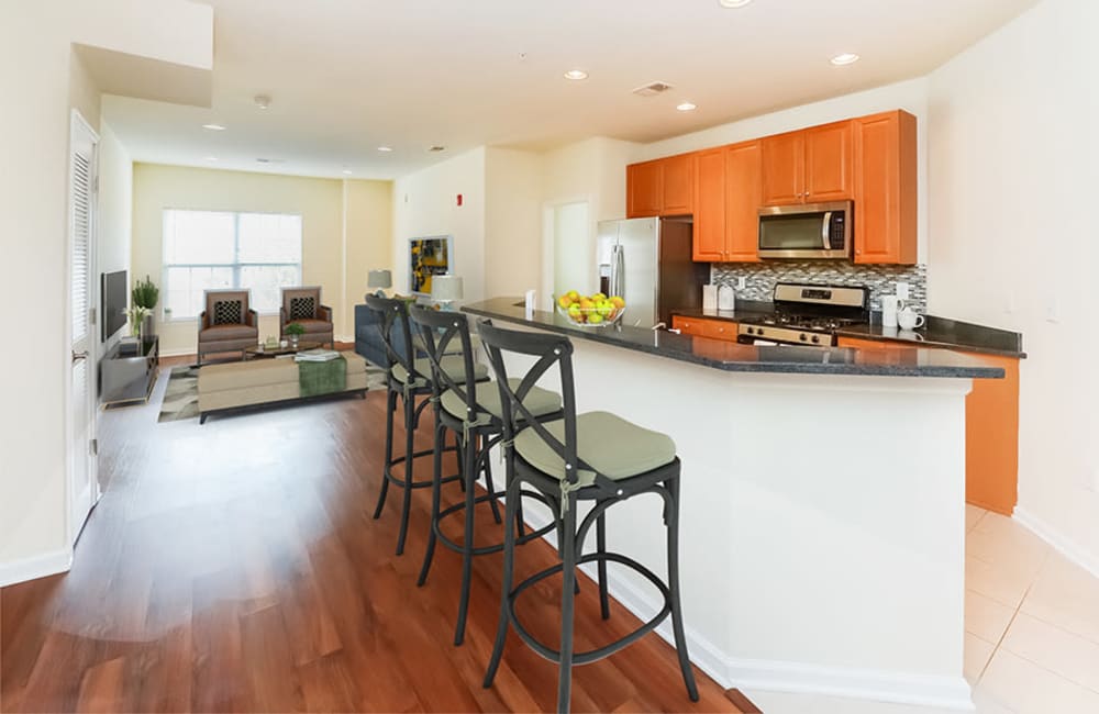 Fully equipped kitchen with a breakfast bar at Cranford Crossing Apartment Homes in Cranford, New Jersey