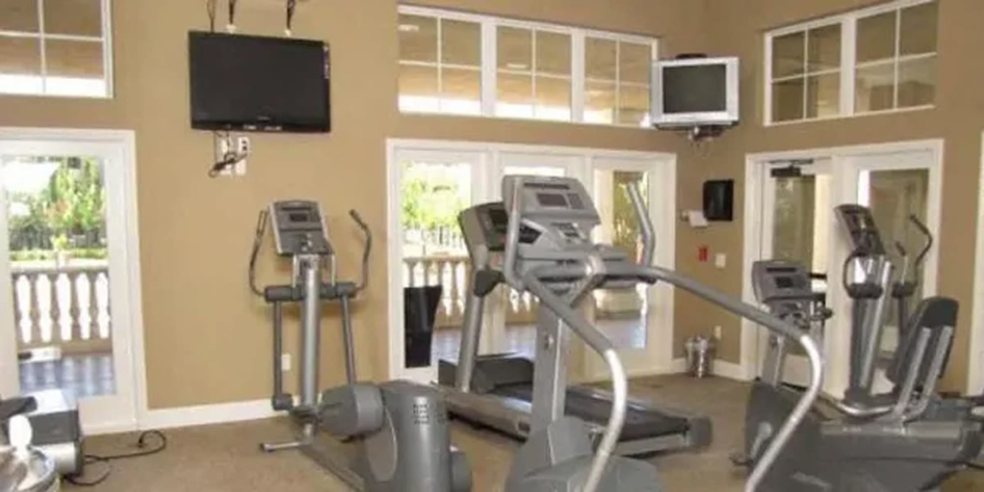 Exercise equipment in the fitness center at Siena Villas Apartments in Elk Grove, California