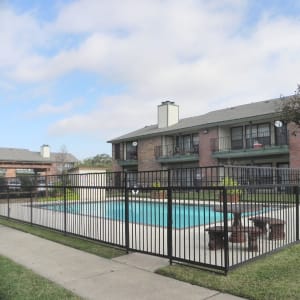 Community swimming pool and deck at Baker Square in Mesquite, Texas