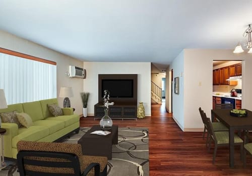 Living room with wood-style flooring at Maiden Bridge & Canongate Apartments in Pittsburgh, Pennsylvania