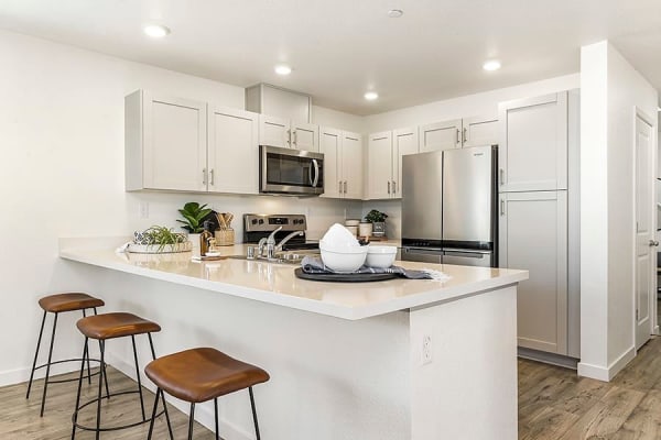 Kitchen with counter seating at Isles in Roseville, California