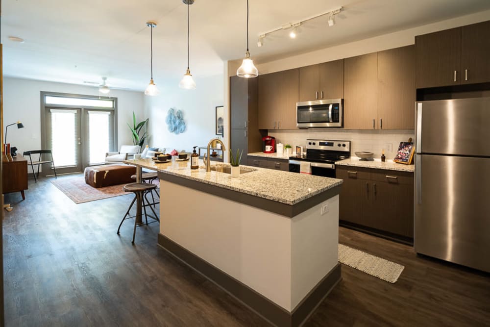 Model kitchen with island at The Crest at Flowery Branch in Flowery Branch, Georgia
