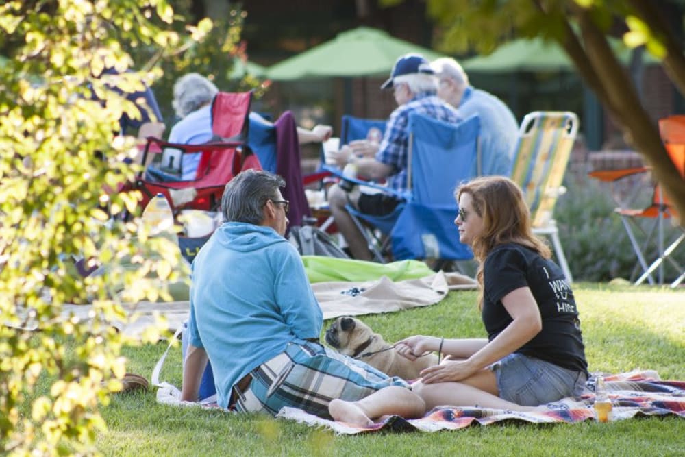 A family enjoying the green space in the town at Eagleview Landing in Exton, Pennsylvania