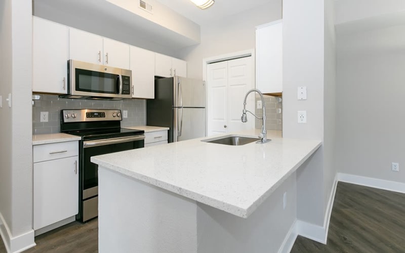 Renovated kitchen with ample cabinet space and stylish finishes at Altitude Westminster in Westminster, Colorado