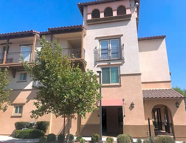 Exterior view of the community at Mercado Apartments in Perris, California