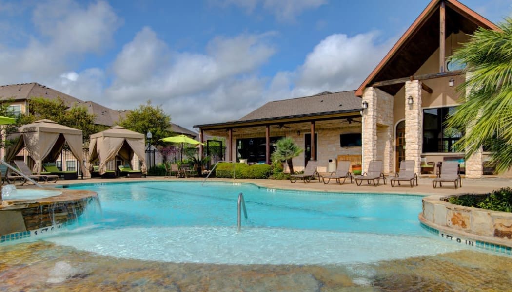 Sparkling pool with gradual entry at Park Hudson Place in Bryan, Texas
