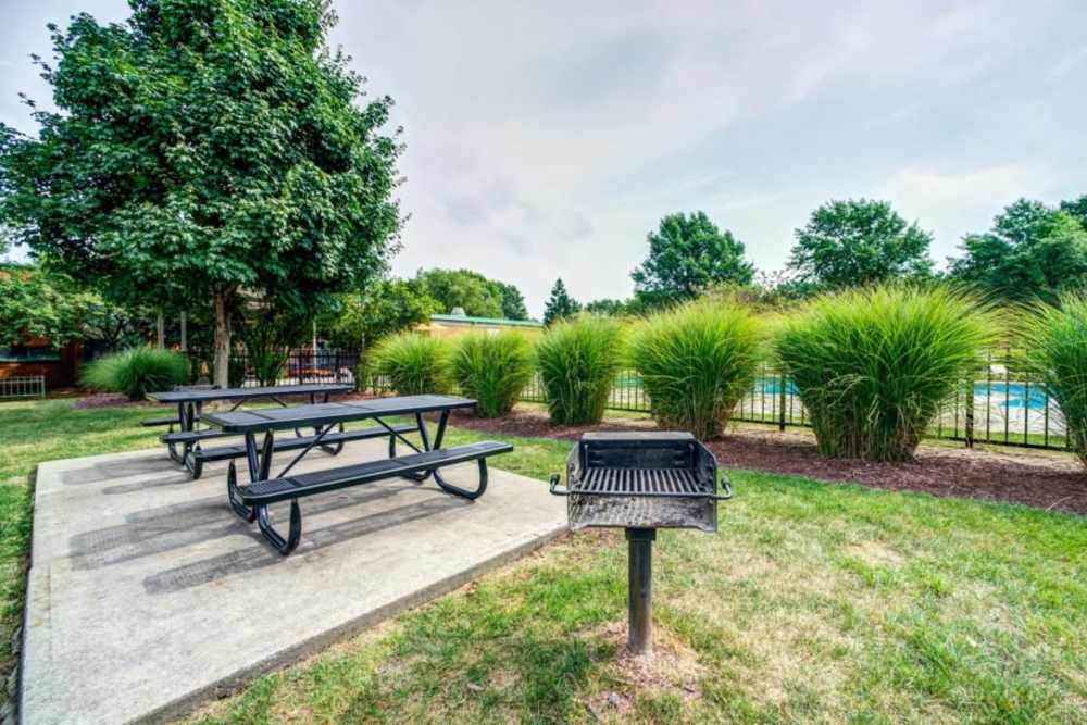 Outdoor seating area at Courtyard Apartments in Columbia,Missouri
