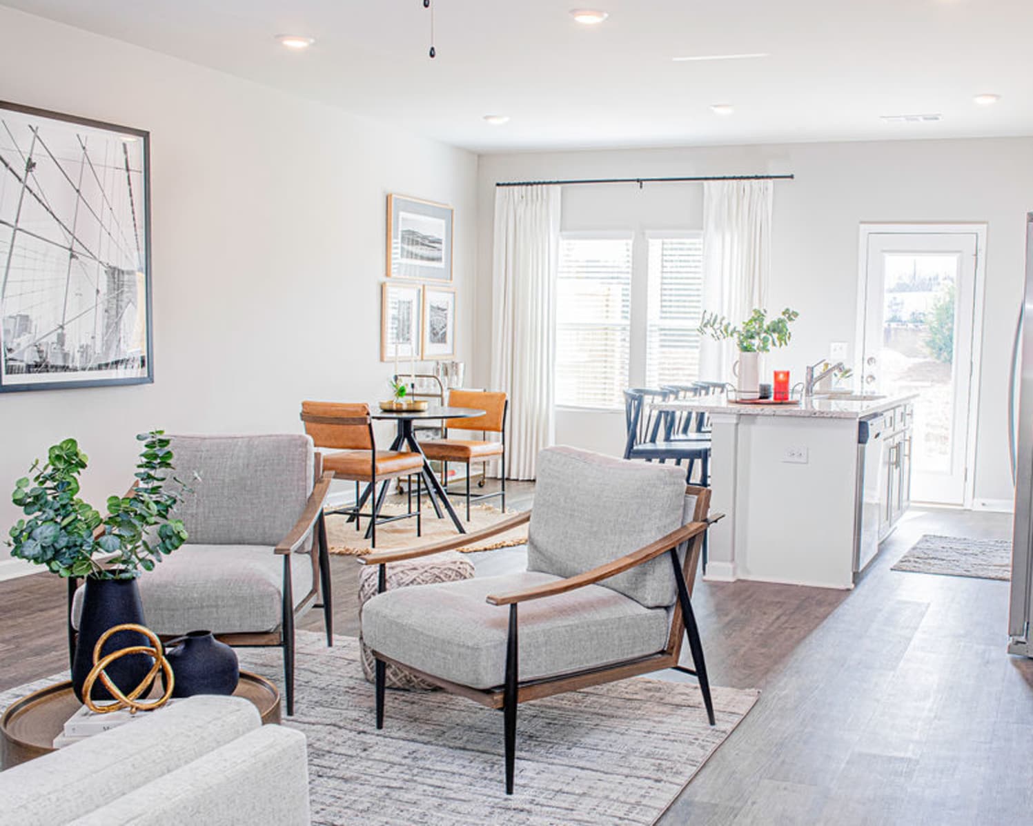 Open concept layout of kitchen, dining, and living room at Brightside at Etowah in Cartersville, Georgia