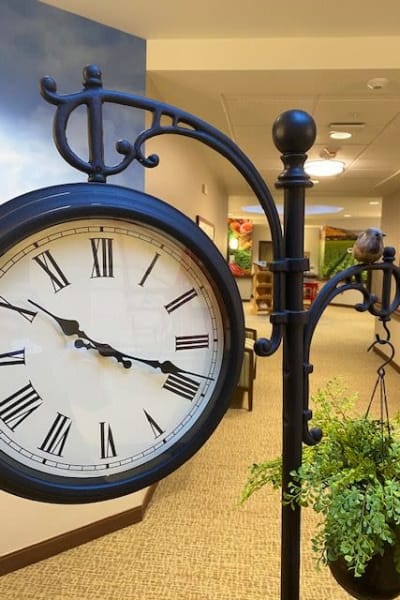 Hanging clock in a hallway at Quail Park at Shannon Ranch in Visalia, California