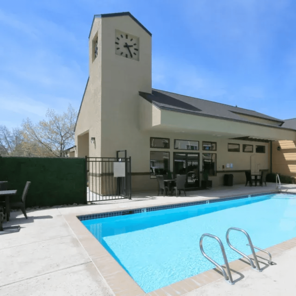 Large community swimming pool and relaxation area at Fountainhouse at Victorian Square in Sparks, Nevada