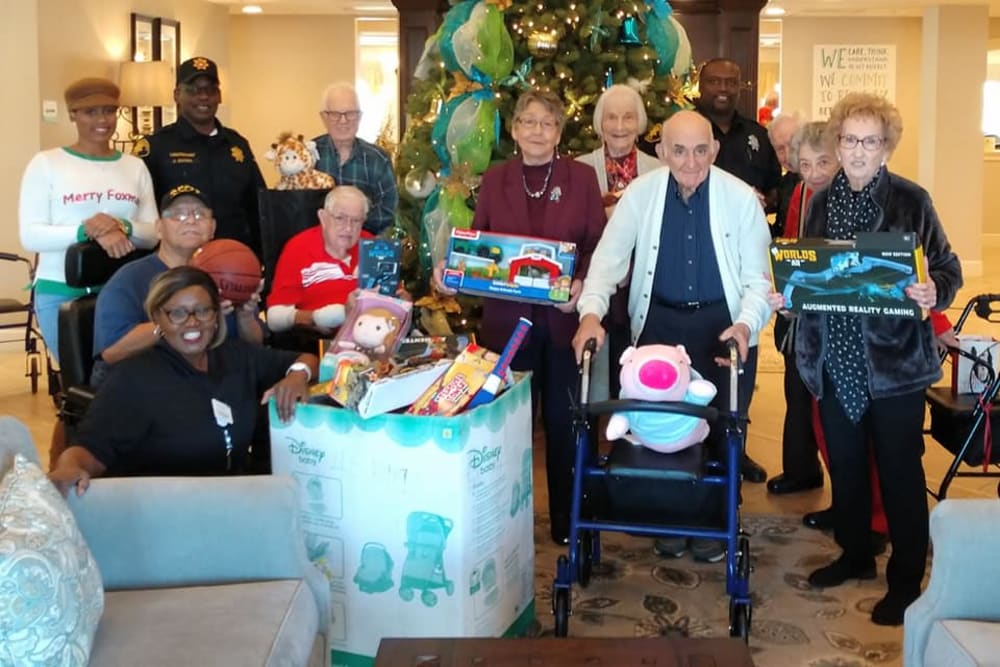 Residents help gather presents at Inspired Living Sugar Land in Sugar Land, Texas.