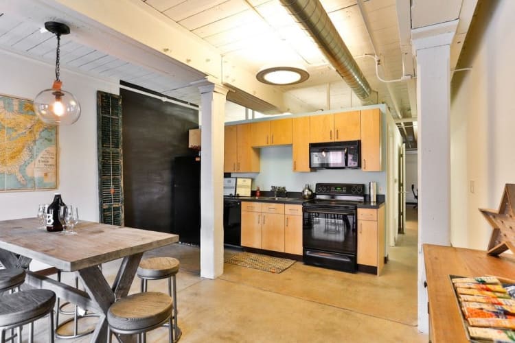 Beautiful kitchen and dining room at Highland Mill Lofts in Charlotte, North Carolina