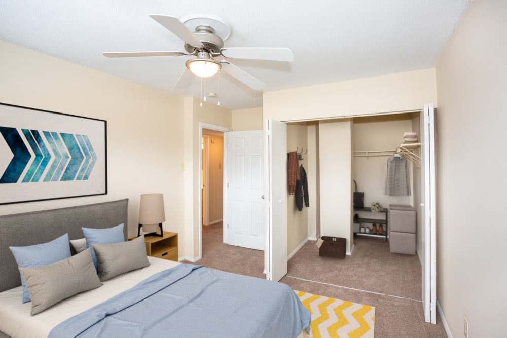 Bedroom with attached walk-in closet at Tiger Village in Columbia, Missouri