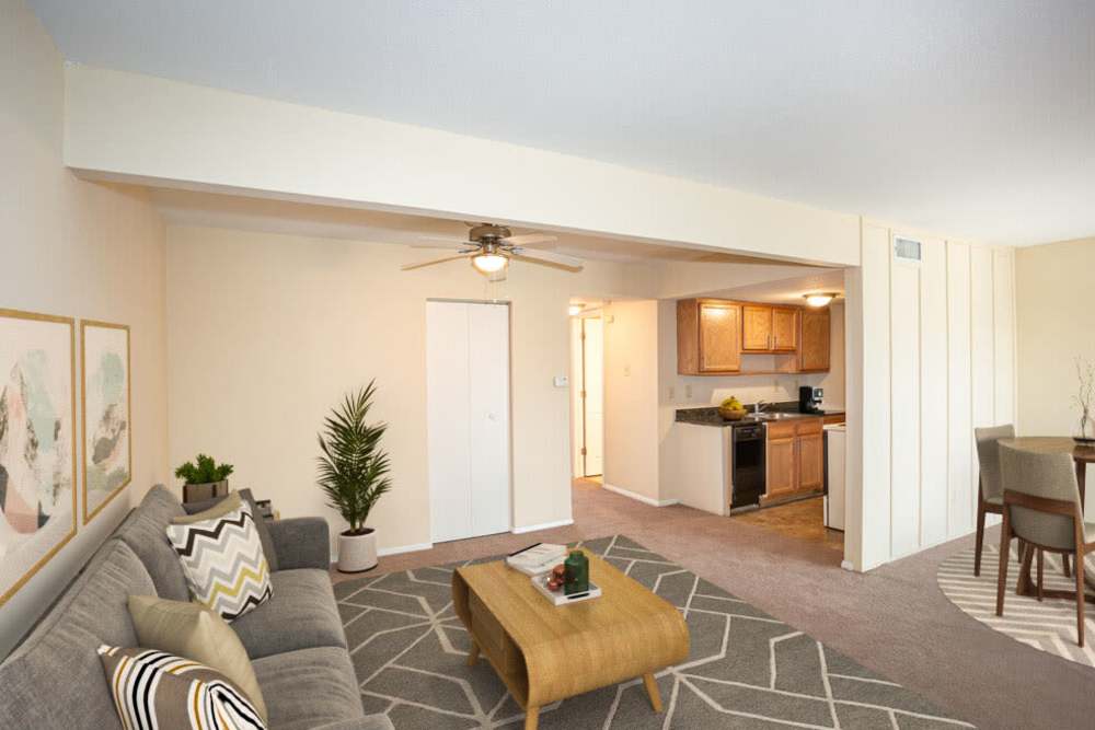 Living room with close access to kitchen and dining area at Tiger Village in Columbia, Missouri