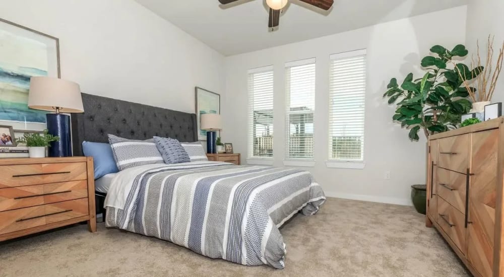 Bedroom with ceiling fan at Luxia Rockwall Downes in Rockwall, Texas