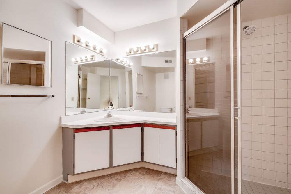 Bathroom with vanity lighting at Carriage Court in Cincinnati, Ohio