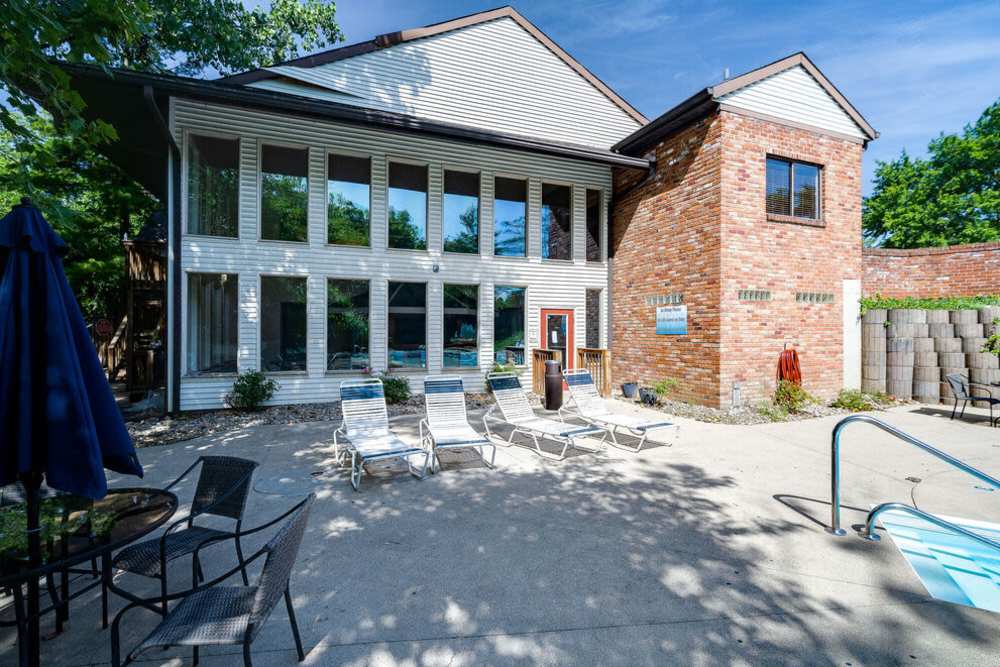 Lounge chairs and sundeck beside the pool area at Carriage Court in Cincinnati, Ohio