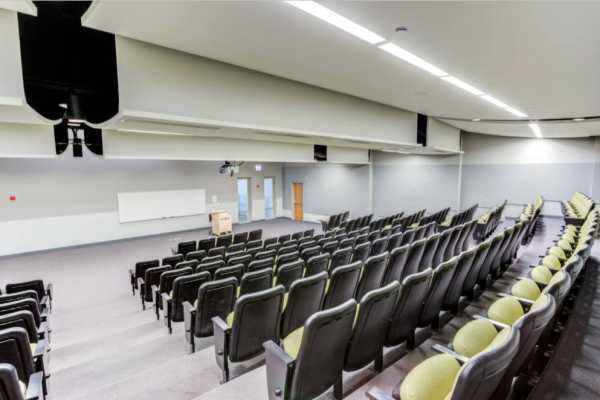 A well-lit conference room at The Flats at East West University in Chicago, Illinois