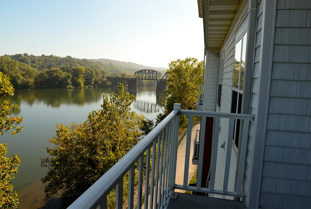 Private balcony with scenic river views at The Waterfront Apartments & Townhomes in Munhall, Pennsylvania