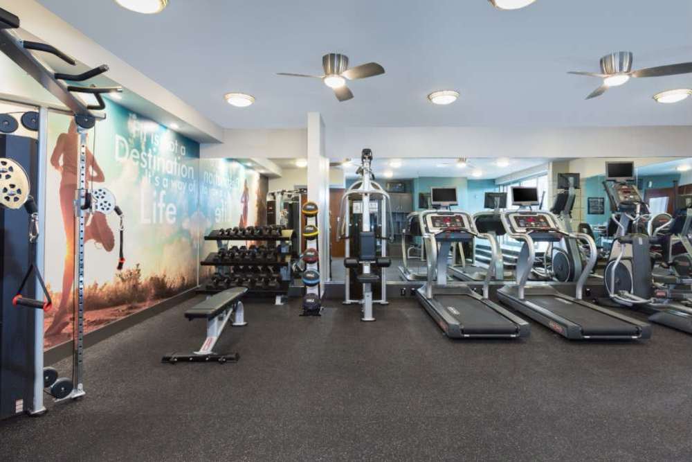Fitness center with various equipment at Belmont Glen Residences in Belmont, California