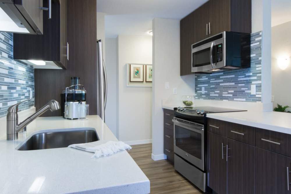 Kitchen with cabinetry and wooden flooring at Belmont Glen Residences in Belmont, California