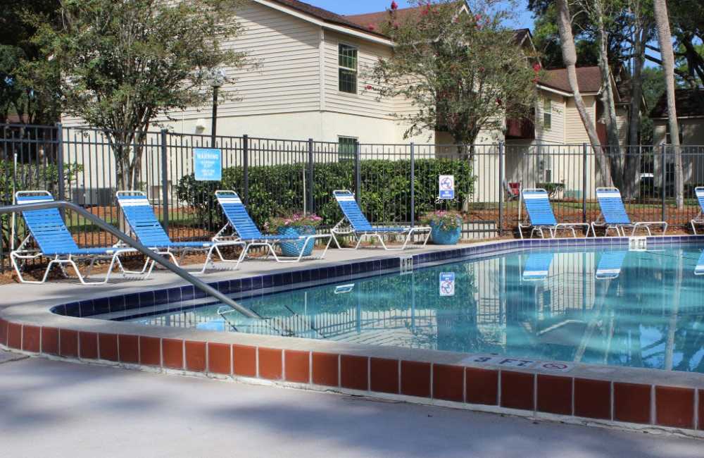 Serene swimming pool at The Dunes Apartments in Jacksonville, Florida