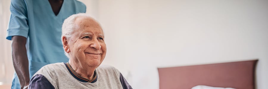 Caretaker bringing a resident to their next appointment at Edgerton Care Center in Edgerton, Wisconsin