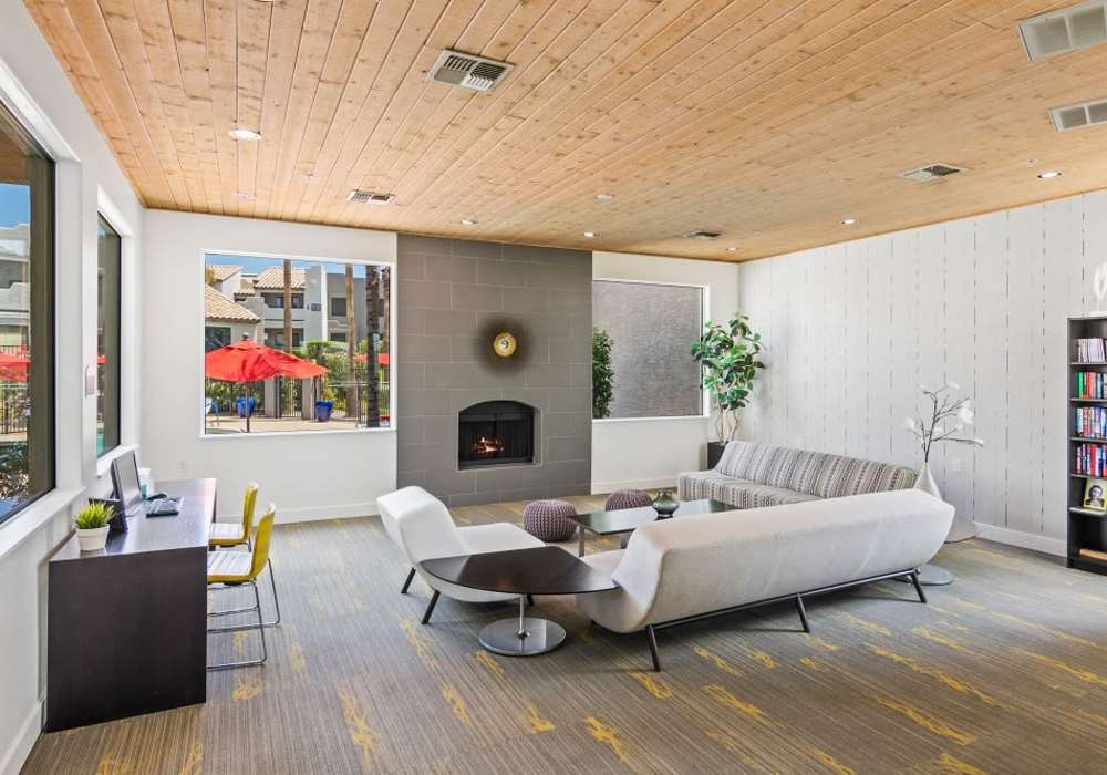 Fireplace and seating area inside leasing office at Cabrillo Apartments in Scottsdale, Arizona