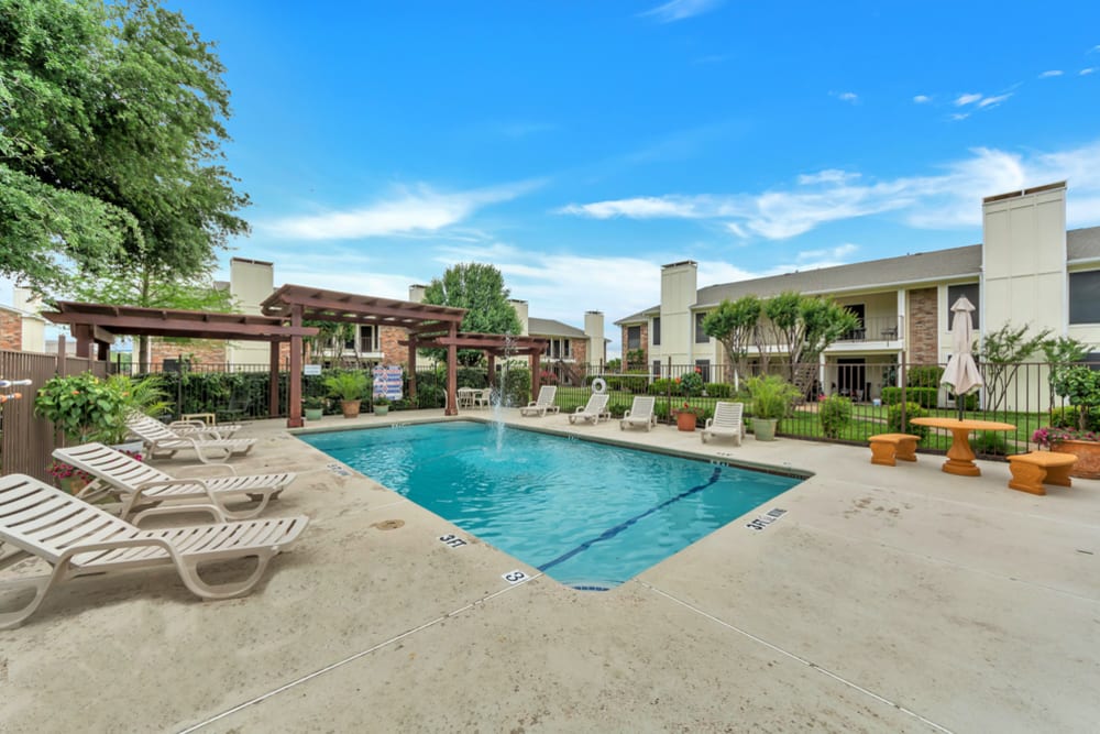 Spacious resort style pool and lounge chairs at Stonegate Apartments in Mckinney, Texas