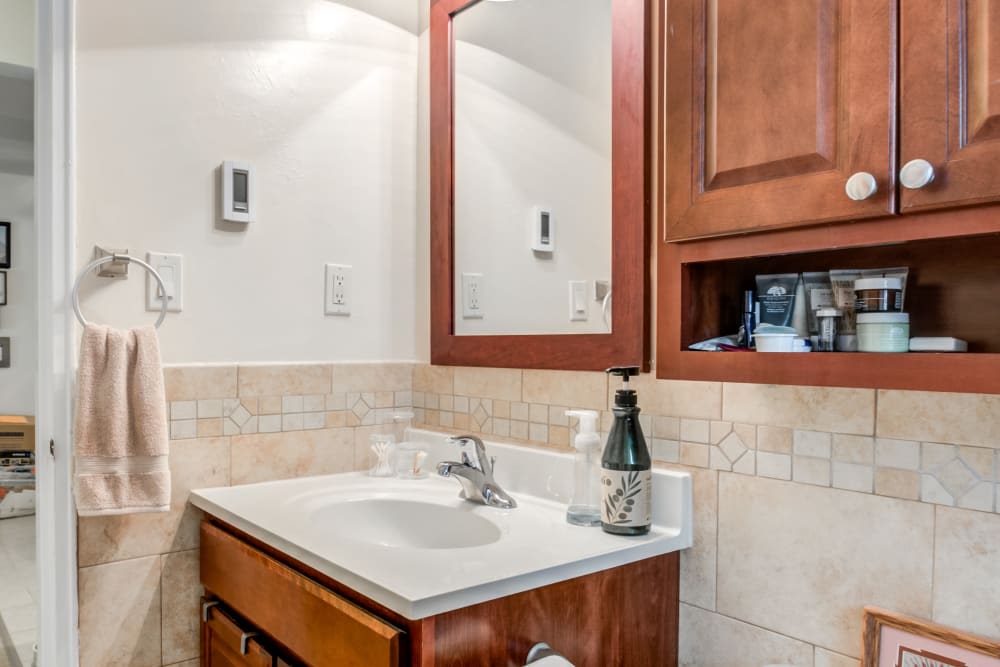 Bathroom mirror and sink at Brinley Manor in Bradley Beach, New Jersey