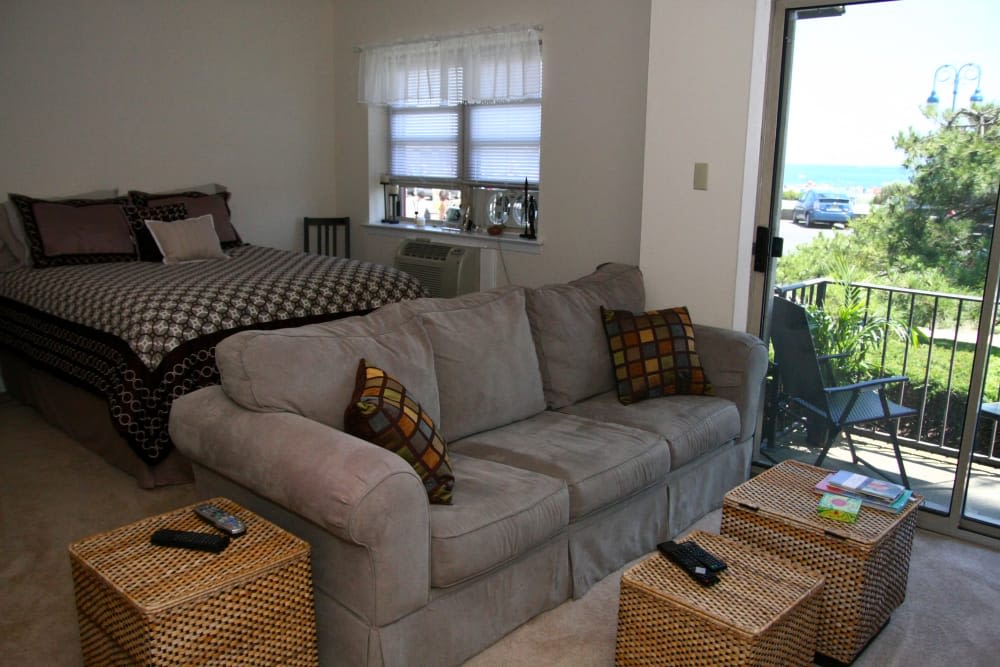 Living room and bedroom at Ocean Harbor Apartments in Belmar, New Jersey