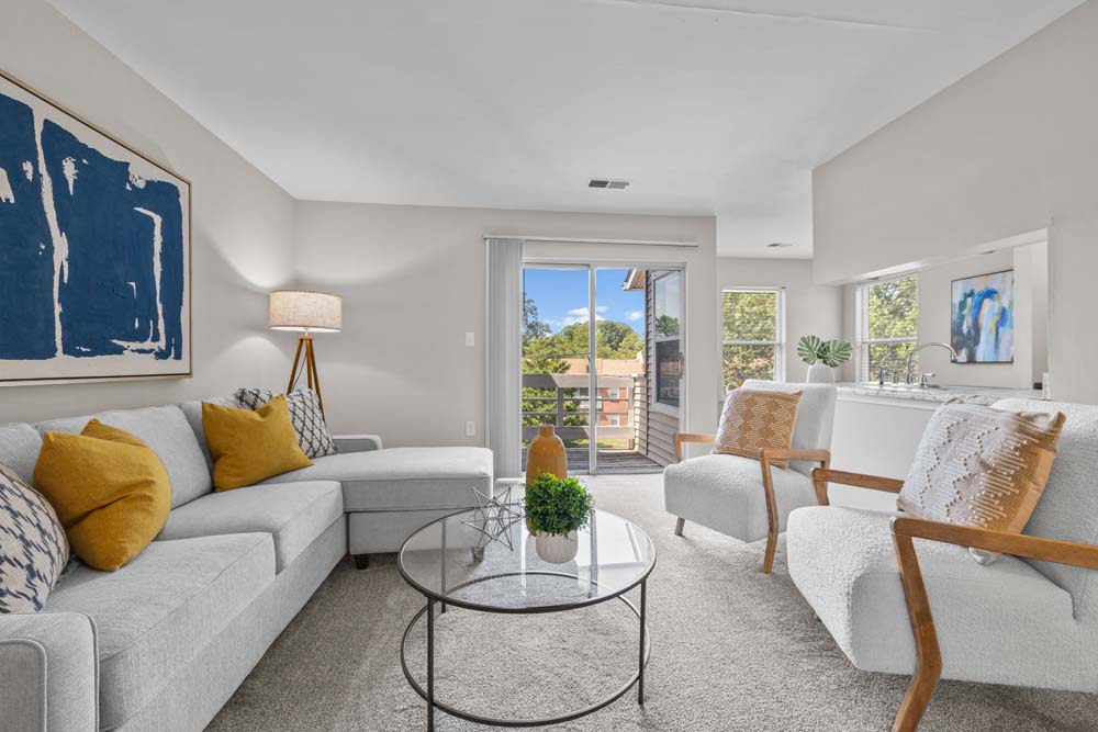 Spacious living room with stunning views at Runaway Bay Apartments in Virginia Beach, Virginia