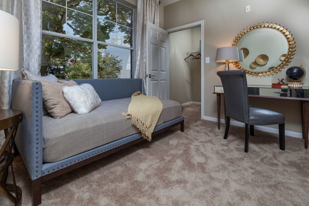 Room with couch and desk at The Spring at Silverton in Fort Worth, Texas