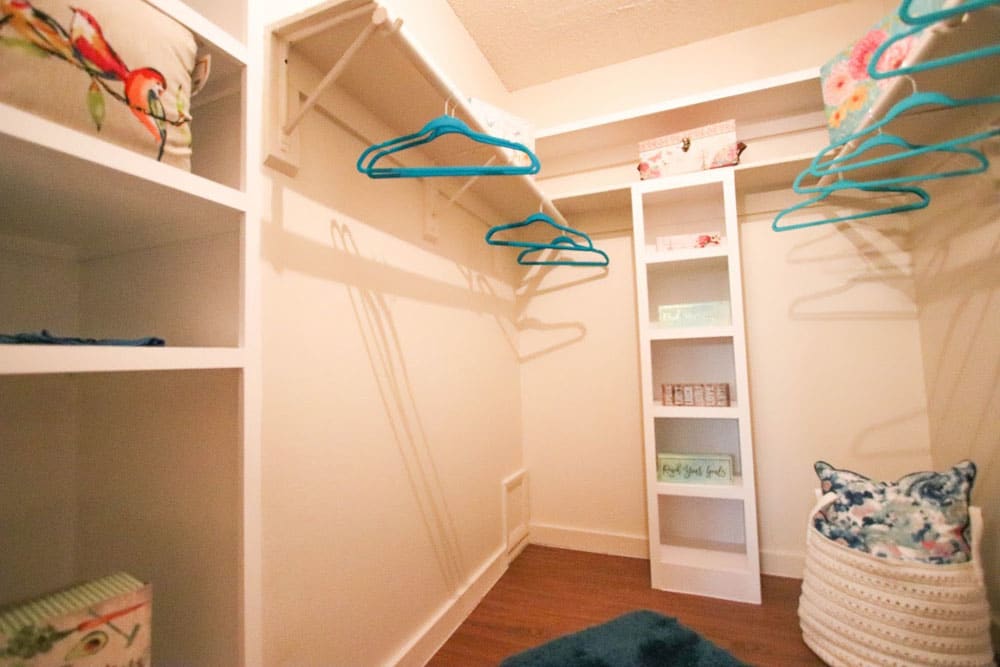 Large walk-in closet with built-in shelving at Buffalo Ridge in Princeton, Texas